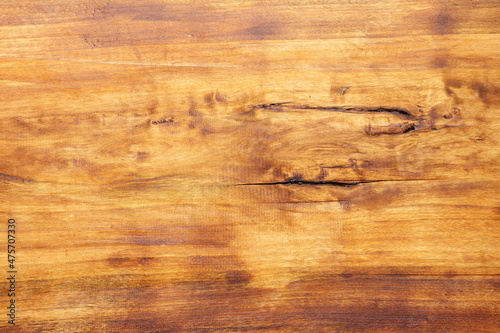 The texture of a wood board painted in walnut color and coated with wood oil. Background from a wooden board. 