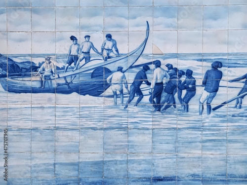 Tiles or Azulejos form a historic motive on the outide facade of Aveiro railway station in Portugal