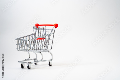 Customer trolley for a store on a white background, place for text, advertising
