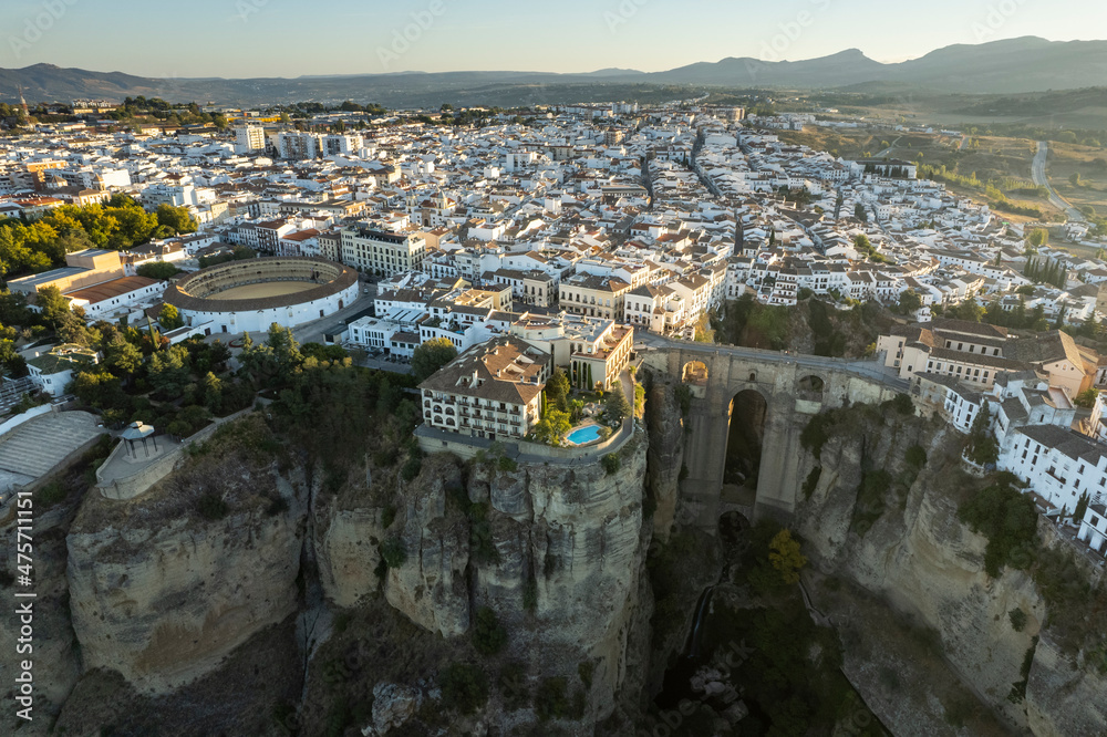 Beautiful landscape of Ronda city from Andalusia, Spain. Wide angle panoramic view from above with the Puente Nuevo bridge and bull fighting arena.
