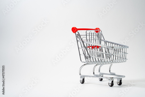 Customer trolley for a store on a white background, place for text, advertising