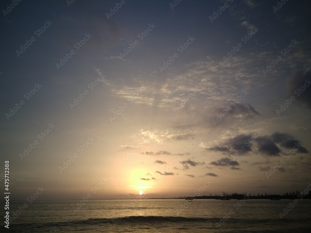 watching the sunset in the afternoon by the beach watching the sunset in the afternoon by the beach