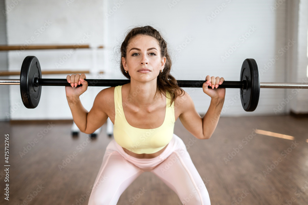 A woman does cardio exercises in the gym. Sportswoman active physical activity sports Pilates. Healthy lifestyle fitness trainer. A woman does cardio exercises in the gym. Sportswoman active physical activity sports Pilates. Healthy lifestyle fitness trainer.