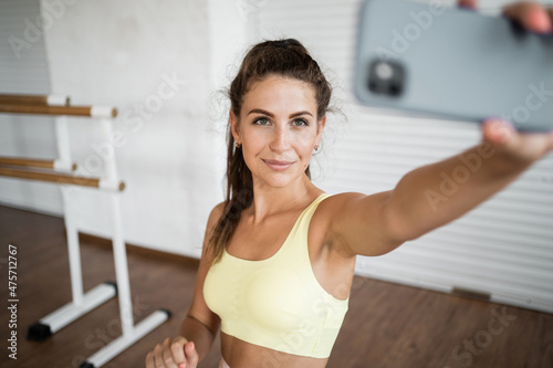 Sportswoman active physical activity sports Pilates. Healthy lifestyle fitness trainer. A woman does cardio exercises in the gym.