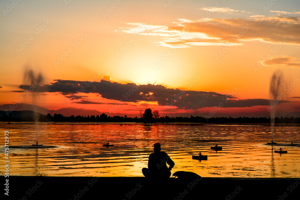 fishing on the banks of dal lake. fishing on the banks of dal lake.