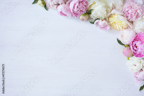 White wooden background with flowers peonies  space for text.