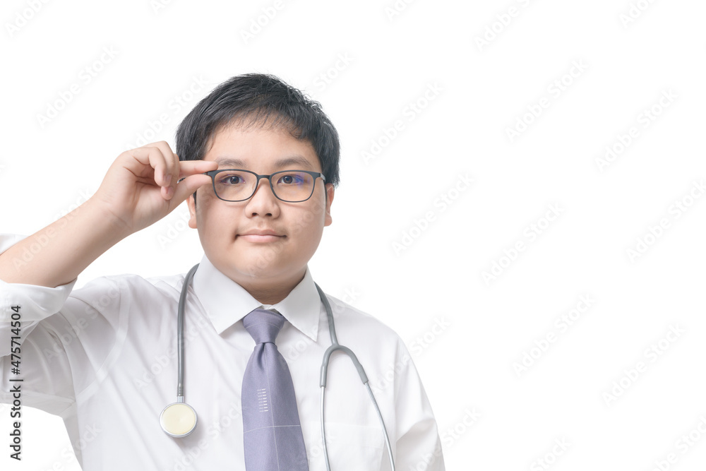 Smart boy wearing eye glasses and white shirt with gray tie and stethoscope isolated Smart boy wearing eye glasses and white shirt with gray tie and stethoscope isolated