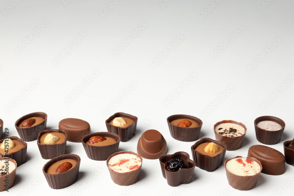 Flat lay composition with chocolate candies on white background Flat lay composition with chocolate candies on white background