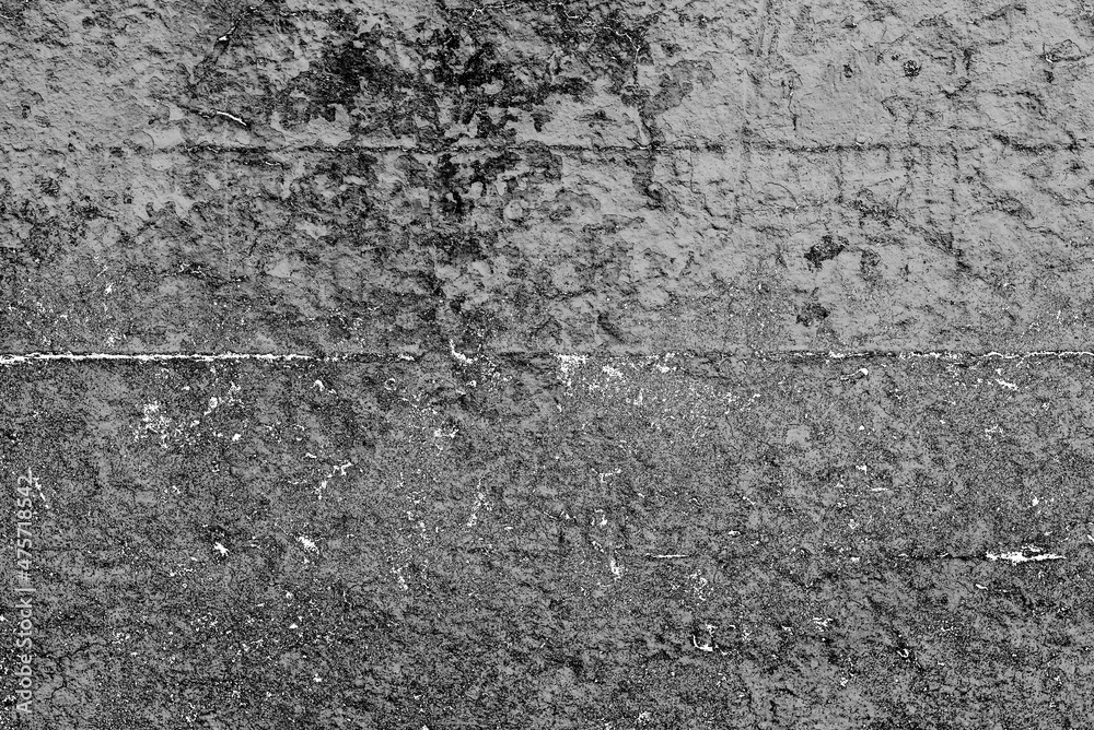 Texture of a concrete wall with cracks and scratches which can be used as a background Texture of a concrete wall with cracks and scratches which can be used as a background