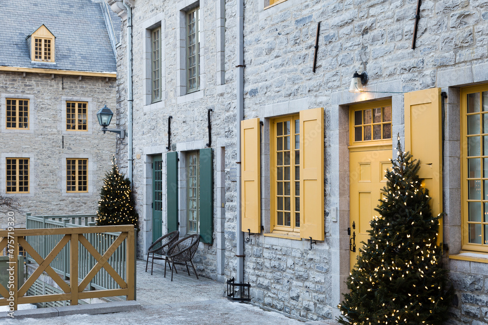 Courtyard and patrimonial houses decorated for Christmas in the old town’s Petit-Champlain area, Quebec City, Quebec, Canada