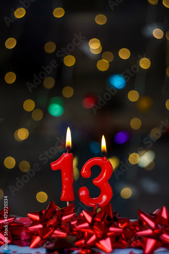 Number 13 Joyful greeting card for birthdays or anniversaries. This image is part of a serie of photos of different numbers burning candles that goes from 1 to 100