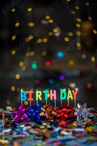 Joyful vertical greeting card for birthdays or anniversaries. The word "Birthday" surrounded by a festive and colorful background © Mireia B.L.