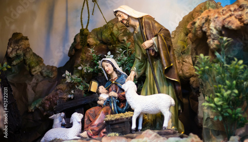 Close-up shot of a Bible figurine of Mary and Joseph in the manger photo