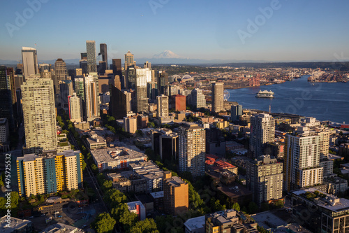 Seattle, Washington, USA - June 4 2021: Seattle downtown skyline and Mount Rainier during summer sunset. View from Seattle needle. © Daniel