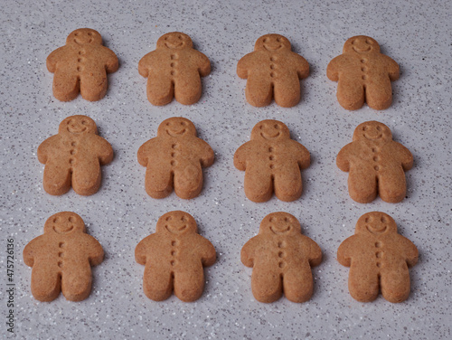 Ginger bread men isolated on a white sparkly background.