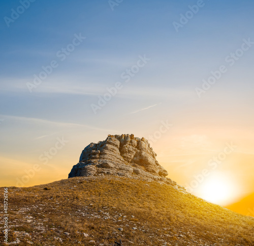 alone mount top at dramatic sunset, natural mountain background