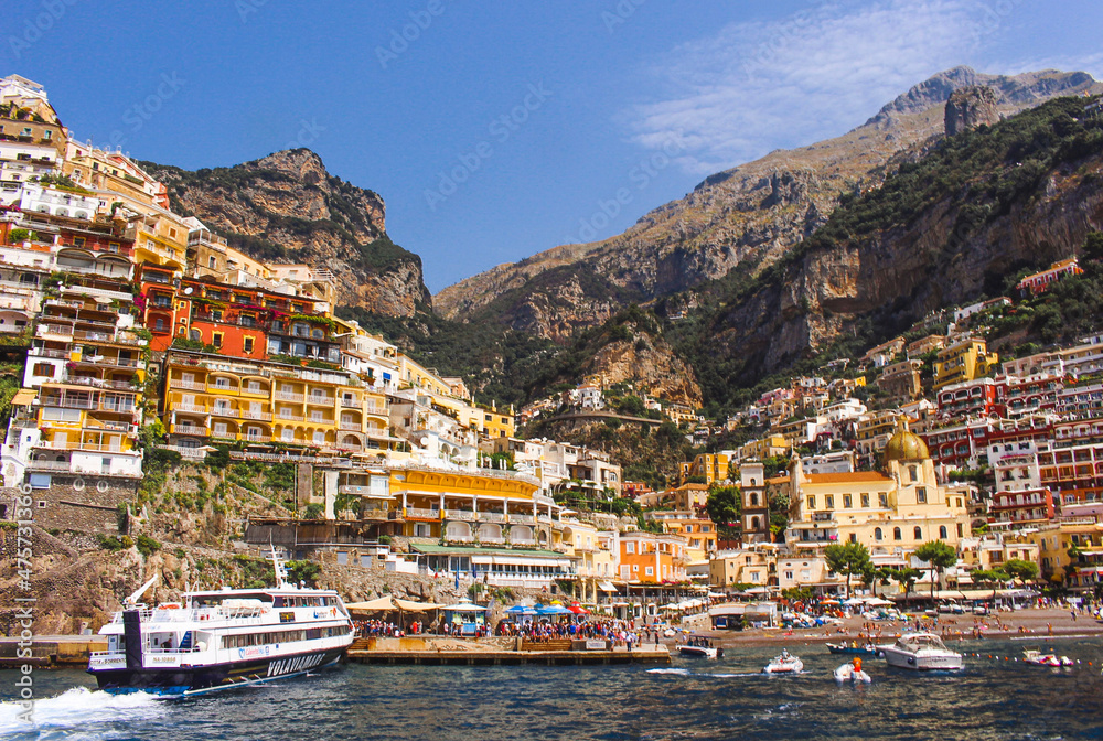 View of the vibrant Amalfi town and beachfront on the coast, Italy.