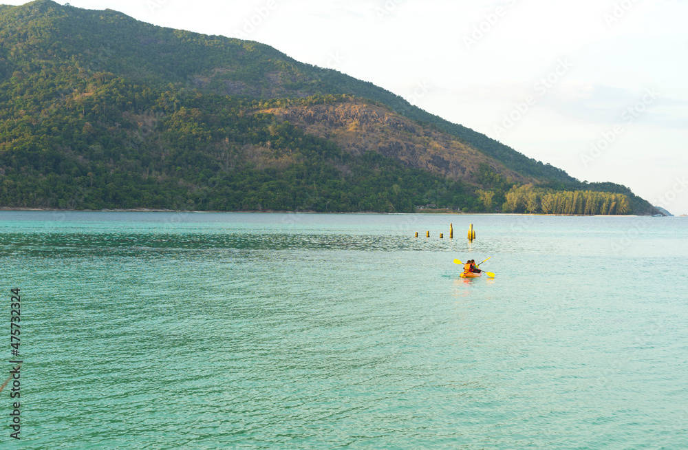 People kayaking in the sea at Ko Lipe island, Tarutao National Park, Satun, Thailand.