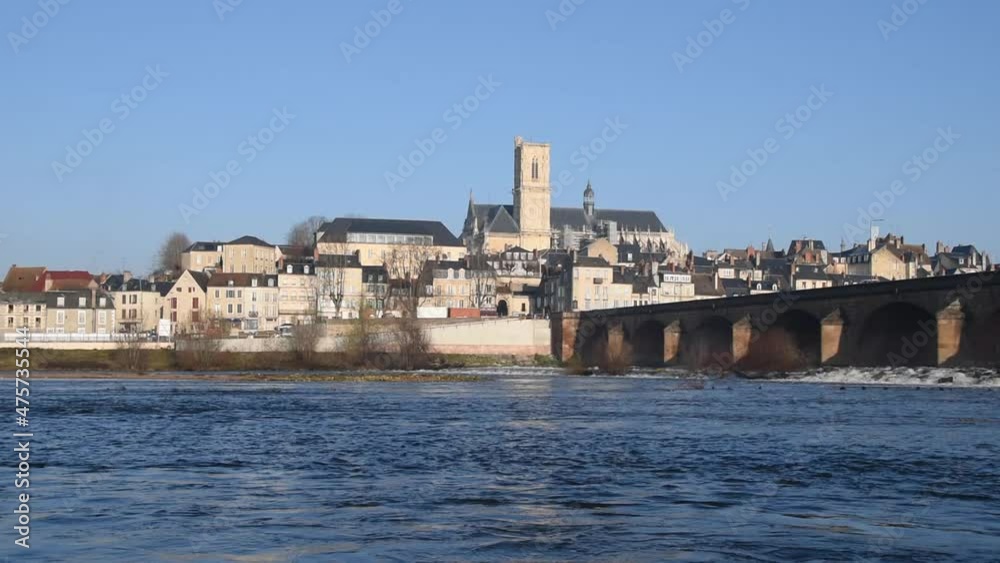Winter landscape with Loire river, bridge and old French town of Nevers Winter landscape with Loire river, bridge and old French town of Nevers