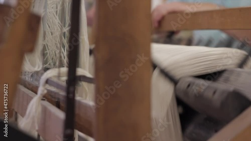 White yarn spinning on a wheel