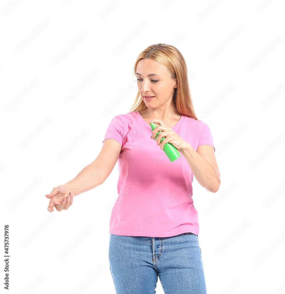Mature woman with mosquito repellent on white background Mature woman with mosquito repellent on white background
