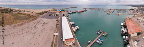 Panoramic view of Burriana s main port in Spain on a cloudy cold winter afternoon and moody colors photo