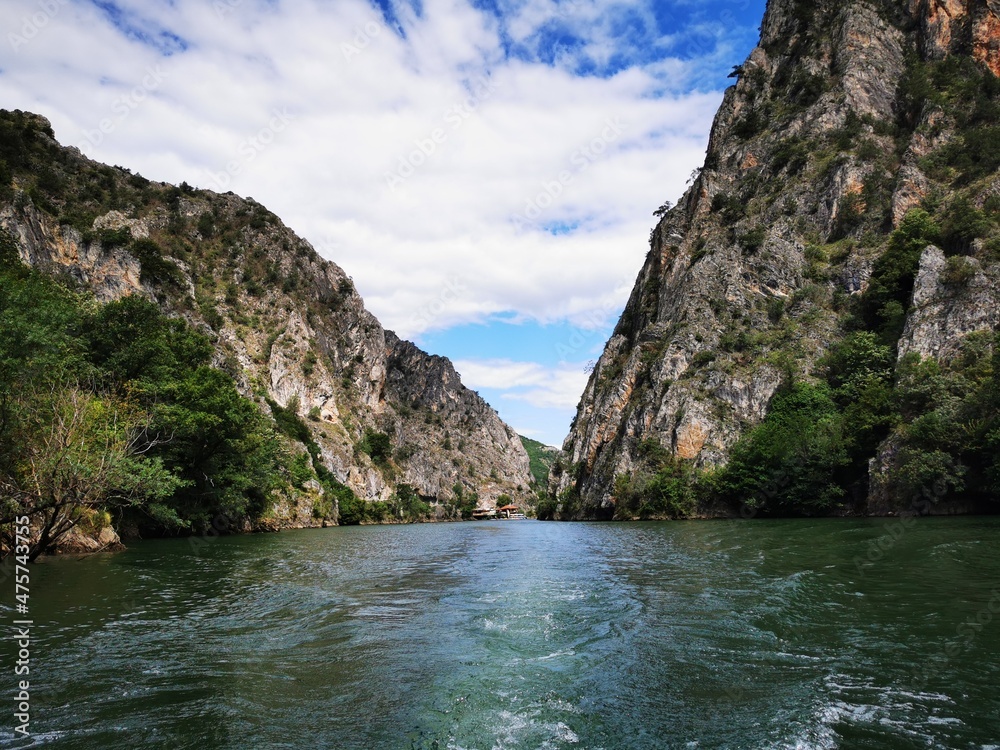
Lake in the Matka canyon - Macedonia. Mountains, emerald water, motor boats. Landscape without people