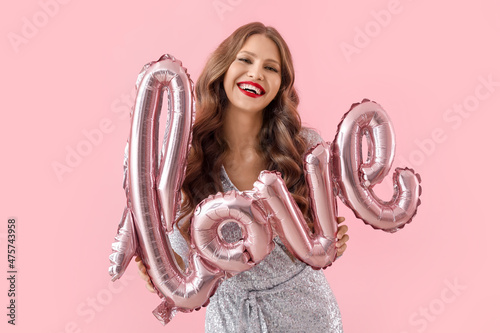Beautiful happy young woman...