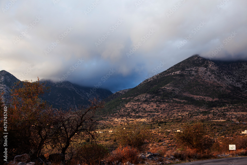 Beautiful greek landscape: seashore with mountains and clouds