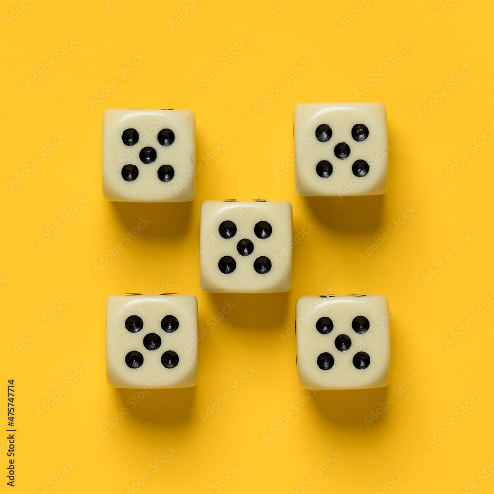 Ideally placed dice, their number and value are the same, on a yellow background. Top view. Ideally placed dice, their number and value are the same, on a yellow background. Top view.