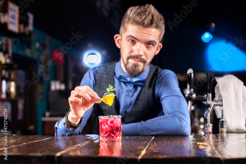 Bartender creates a cocktail at the alehouse photo