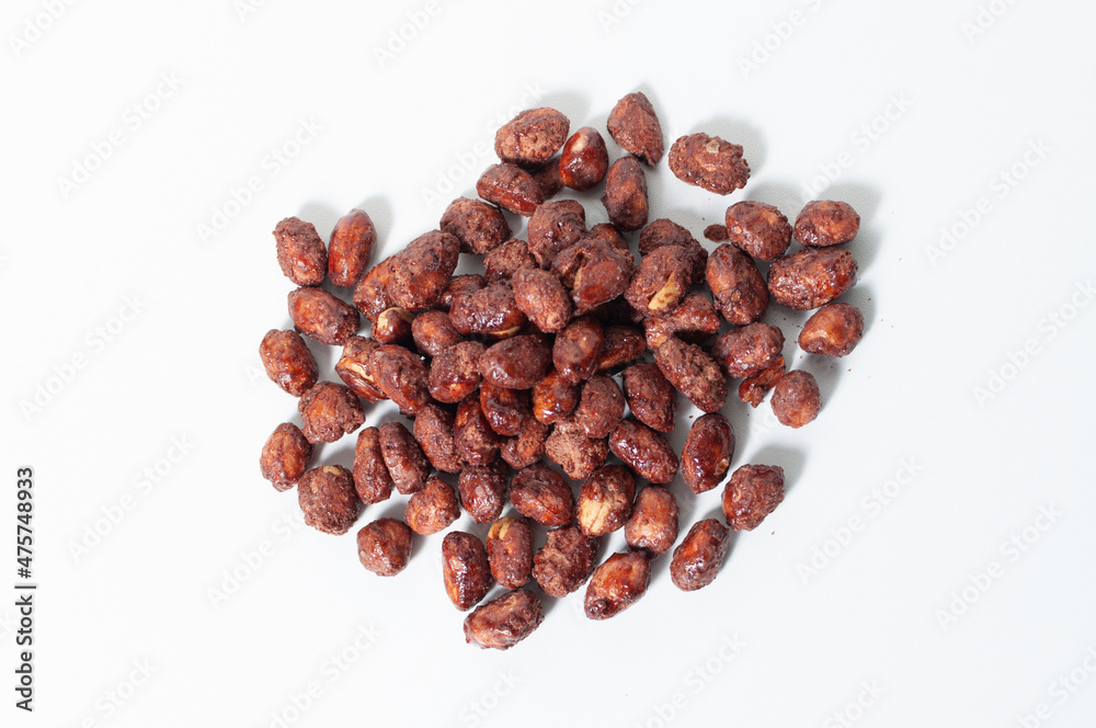 Top view of some peanuts praline sweet on white table or background. Top view of some peanuts praline sweet on white table or background.