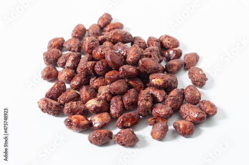 Some peanuts praline sweet on white table or background.