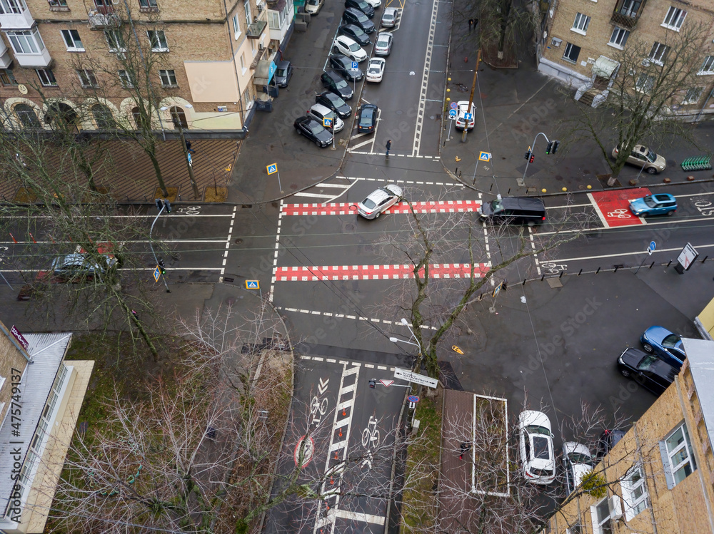 Obraz premium City street with a bike path in Kiev in cloudy weather. Aerial drone view.