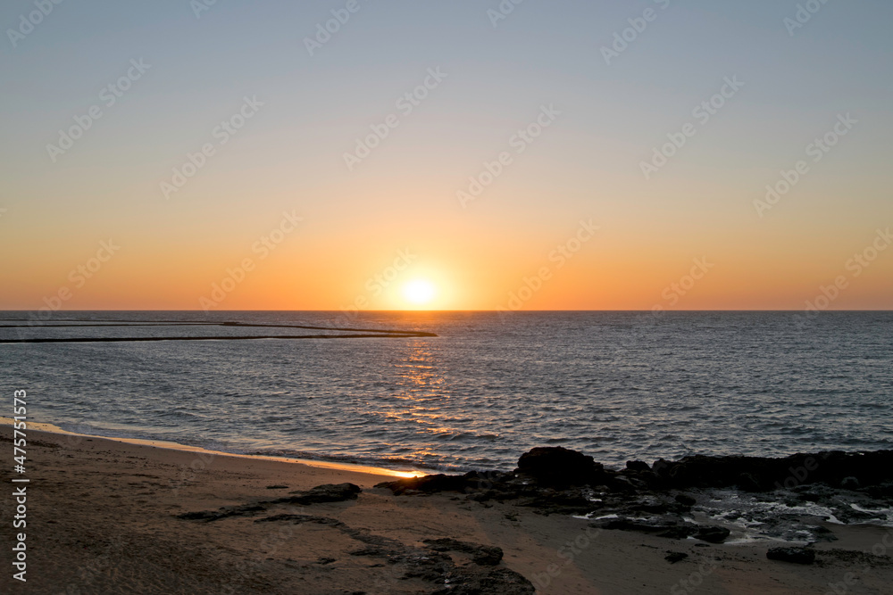 Sunset on a beach in Chipiona, Cadiz, Andalusia, Spain