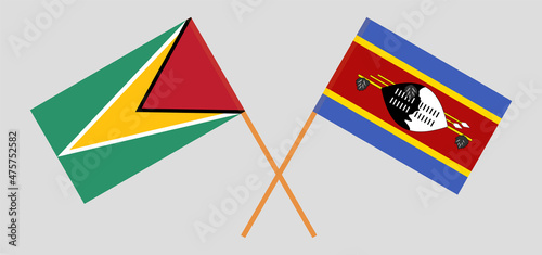 Crossed flags of Guyana and Eswatini. Official colors. Correct proportion