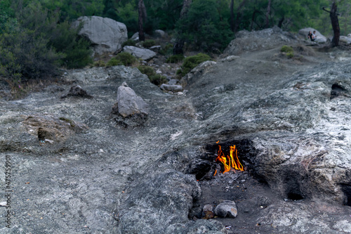 constantly burning fire at the place of a natural gas emission on Mount Chimaera (Yanartas), Turkey