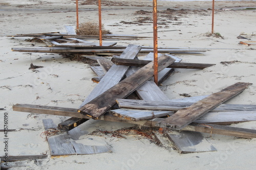 Old broken wood pieces on the beach. Photo taken in burhaniye aegean sea coast turkey anatolia asia. Calm cold cool weather day in winter on december 2021 photo