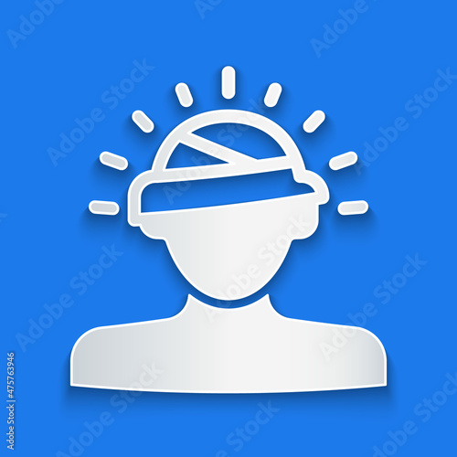Paper cut Concussion, headache, dizziness, migraine icon isolated on blue background. Paper art style. Vector