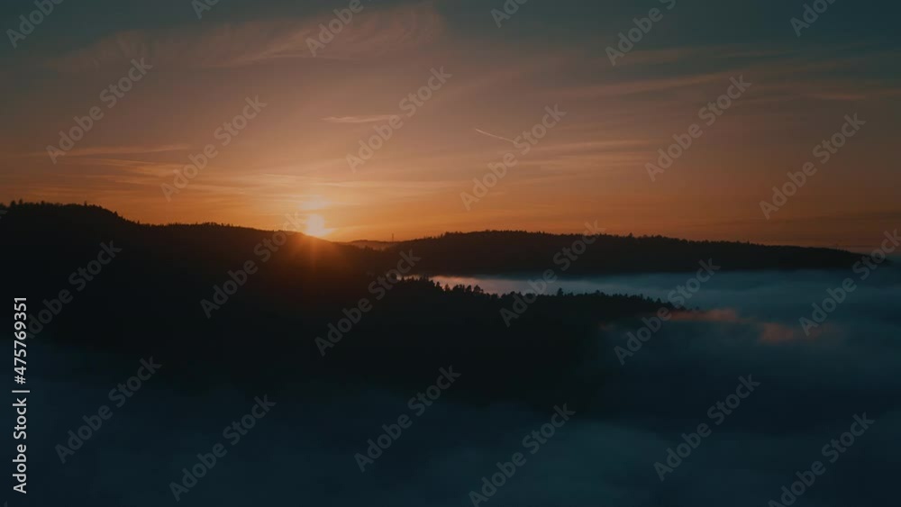 aerial shot above fog during sunset aerial shot above fog during sunset
