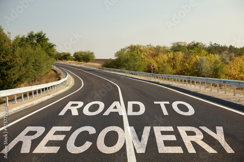 Start to live without alcohol addiction. Phrase ROAD TO RECOVERY on asphalt highway