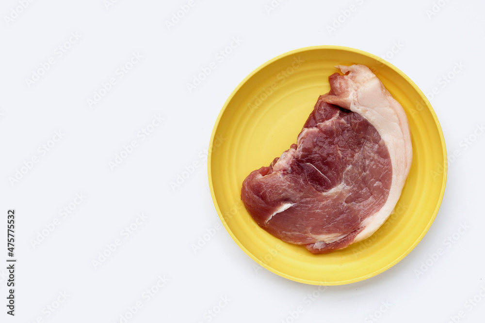 Pork meat in yellow plate on white background. Pork meat in yellow plate on white background.