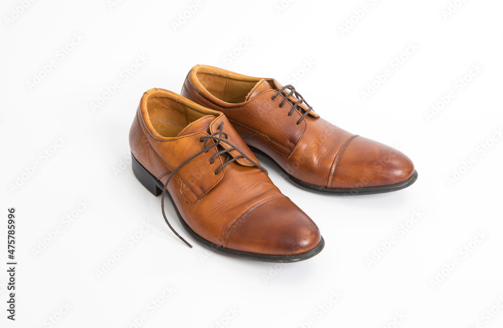 Brown leather mens shoes isolated on white background.