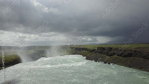 Drone jibs up from top of waterfall