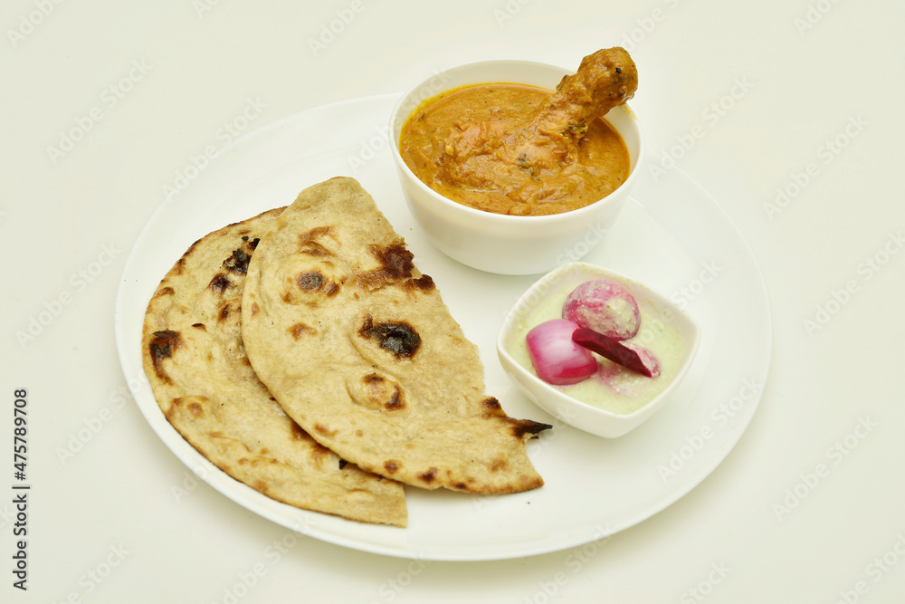 Butter Chicken and Roti with Chutney Onion in Plate on White Background Butter Chicken and Roti with Chutney Onion in Plate on White Background