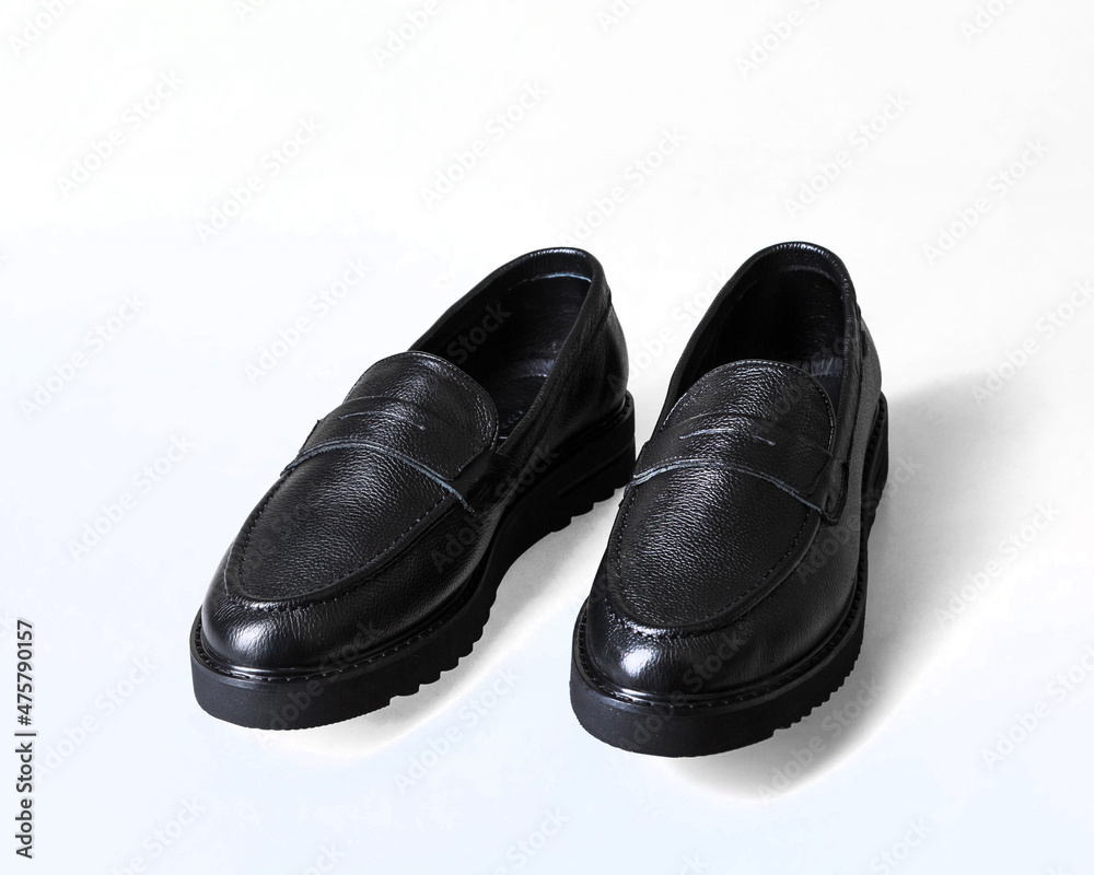 Pair of black leather boots. Isolated on a white background.