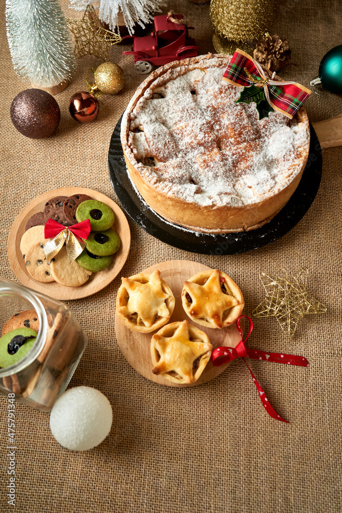 Christmas cake and biscuit on rustic background Christmas cake and biscuit on rustic background