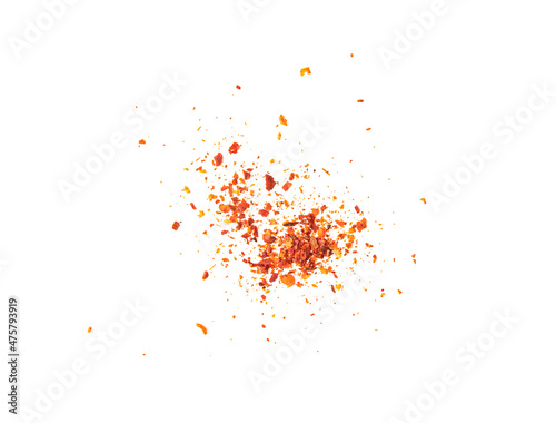 Dried chili flakes and seeds isolated on white background, top view