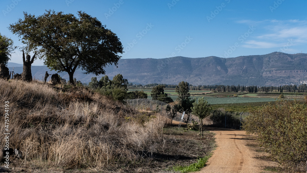 View of Hula Valley and Naftali Mountain Range in the west as seen from Kibbutz Kfar Szold, located at the foot of the Golan Heights in the east, Upper Galilee, Northern Israel, Israel. View of Hula Valley and Naftali Mountain Range in the west as seen from Kibbutz Kfar Szold, located at the foot of the Golan Heights in the east, Upper Galilee, Northern Israel, Israel.