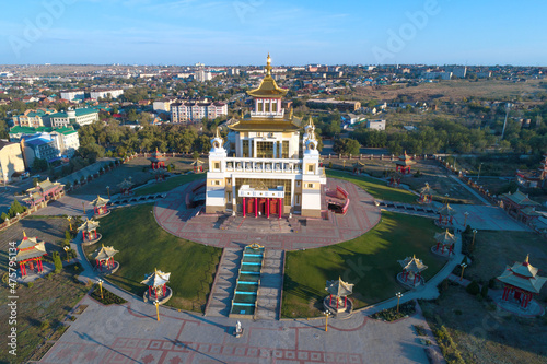 Buddhist temple "Golden abode of Buddha Shakyamuni" in the cityscape on a sunny September morning (aerial photography). Elista, Republic of Kalmykia. Russia